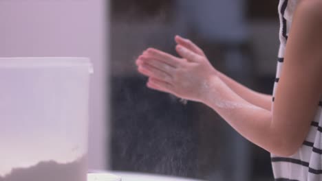 Child-clapping-flour-from-hands-4K